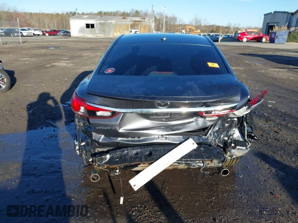 2014 Mazda 6 i Grand Touring with VIN JM1GJ1W50E1107877, listed as a IAAI auction lot 41857596 with 166,188 mi miles and . Bid and sale history available at DreamBid. Image 6.