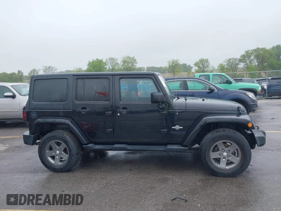 2013 Jeep Wrangler Unlimited Sport z VIN 1C4BJWDGXDL596450, wystawiony jako IAAI lot #42323862 z przebiegiem 114 105 mil mil oraz . Historia ofert i sprzedaży dostępna na DreamBid. Obrazek 14.