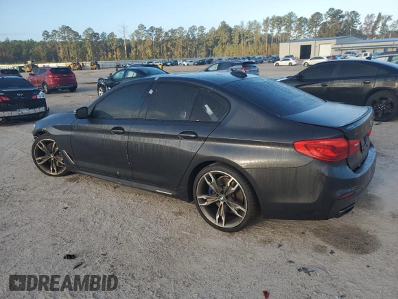 2019 BMW 5 Series M550i xDrive with VIN WBAJB9C57KB288906, listed as a Copart auction lot 79846274 with 61,744 mi miles and Salvage title. Bid and sale history available at DreamBid. Image 2.