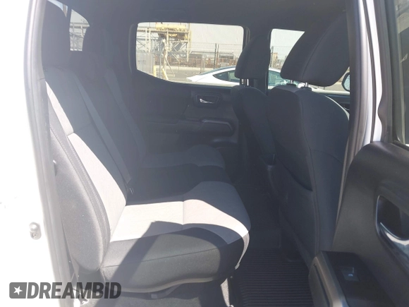 2023 Toyota Tacoma SR5 z VIN 3TMDZ5BN3PM160975, wystawiony jako IAAI lot #42024778 z przebiegiem 41 621 mil mil oraz . Historia ofert i sprzedaży dostępna na DreamBid. Obrazek 8.