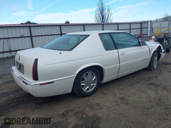 1998 Cadillac Eldorado z VIN 1G6EL12Y2WU603722, wystawiony jako IAAI lot #41879733 z przebiegiem 81 780 mil mil oraz . Historia ofert i sprzedaży dostępna na DreamBid. Obrazek 4.