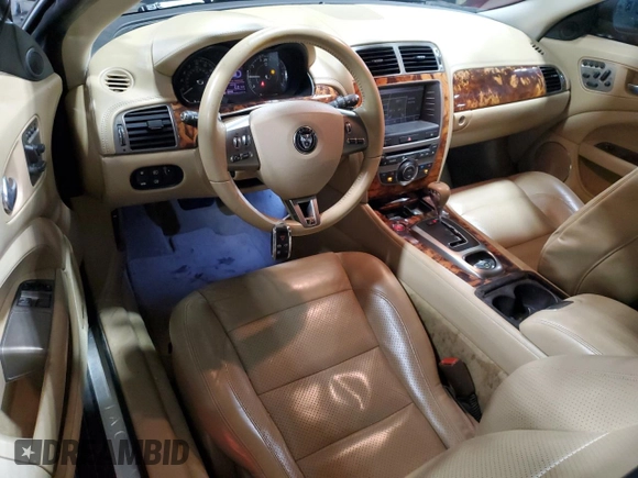 2007 Jaguar XK with VIN SAJWA43C479B18700, listed as a Copart auction lot 83377684 with 143,746 mi miles and Salvage Title. Bid and sale history available at carsss.com. Image 8.