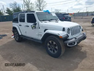 2018 Jeep Wrangler Unlimited Sahara with VIN 1C4HJXEG1JW119401, listed as a IAAI auction lot 42213387 with 48,927 mi miles and . Bid and sale history available at DreamBid. Image 1.