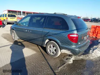 2005 Dodge Caravan SXT with VIN 2D4GP44L55R477013, listed as a IAAI auction lot 41670454 with 166,351 mi miles. Bid and sale history available at carsss.com. Image 3.