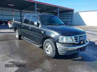 2001 Ford F-150 SuperCrew XLT with VIN 1FTRW07W41KA13131, listed as a IAAI auction lot 41922077 with 1 mi miles. Bid and sale history available at carsss.com. Image 1.