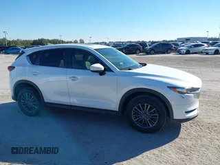 2020 Mazda CX-5 Touring with VIN JM3KFACM6L0737727, listed as a IAAI auction lot 41283200 with 85,949 mi miles and . Bid and sale history available at carsss.com. Image 13.