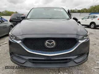 2020 Mazda CX-5 Touring with VIN JM3KFBCM1L0792706, listed as a Copart auction lot 73032144 with 56,845 mi miles and Salvage Title. Bid and sale history available at carsss.com. Image 5.
