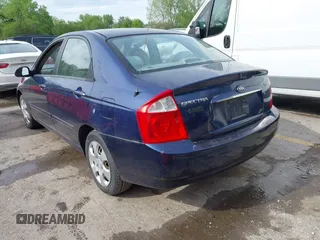 2006 Kia Spectra EX with VIN KNAFE122965293874, listed as a IAAI auction lot 42111219 with 241,644 mi miles. Bid and sale history available at carsss.com. Image 3.