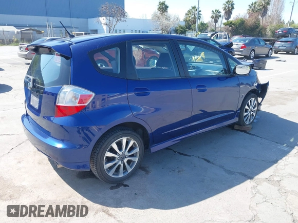 2013 Honda Fit Sport with VIN JHMGE8H52DC033096, listed as a IAAI auction lot 41767007 with 70,398 mi miles. Bid and sale history available at carsss.com. Image 4.