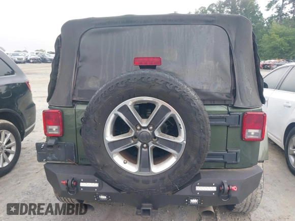 2008 Jeep Wrangler Sahara with VIN 1J4FA54118L653044, listed as a IAAI auction lot 42557244 with 152,072 mi miles and . Bid and sale history available at DreamBid. Image 16.