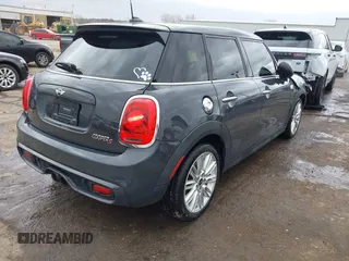 2017 MINI Hardtop 4 Door Cooper S z VIN WMWXU3C3XH2F49201, wystawiony jako IAAI lot #41837027 z przebiegiem 75 949 mil mil oraz . Historia ofert i sprzedaży dostępna na DreamBid. Obrazek 4.