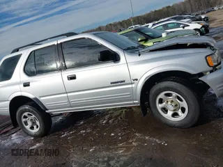 2001 Honda Passport LX z VIN 4S6CK58W014401073, wystawiony jako IAAI lot #41380551 z przebiegiem 259 878 mil mil oraz . Historia ofert i sprzedaży dostępna na DreamBid. Obrazek 13.