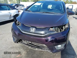 2016 Honda Fit EX with VIN JHMGK5H7XGS013097, listed as a IAAI auction lot 42290807 with 62,352 mi miles and . Bid and sale history available at DreamBid. Image 6.