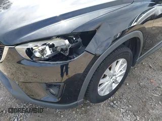 2014 Mazda CX-5 Touring with VIN JM3KE2CY9E0333951, listed as a IAAI auction lot 41825345 with 124,684 mi miles. Bid and sale history available at carsss.com. Image 6.