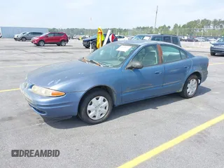 1999 Oldsmobile Alero GL z VIN 1G3NL52TXXC339892, wystawiony jako IAAI lot #41935539 z przebiegiem 315 555 mil mil oraz . Historia ofert i sprzedaży dostępna na DreamBid. Obrazek 2.