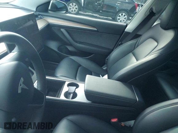 2023 Tesla Model 3 z VIN 5YJ3E1EA7PF573852, wystawiony jako Copart lot #57662565 z przebiegiem Nie podano mil oraz Szkoda całkowita • Salvage title. Historia ofert i sprzedaży dostępna na DreamBid. Obrazek 9.
