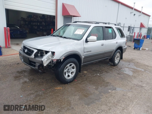 2001 Honda Passport LX z VIN 4S6CK58W714414399, wystawiony jako IAAI lot #41641270 z przebiegiem 203 093 mil mil oraz . Historia ofert i sprzedaży dostępna na DreamBid. Obrazek 2.
