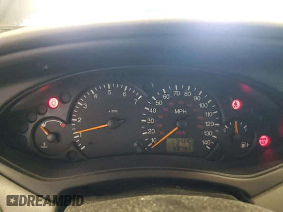 2002 Ford Focus ZX5 z VIN 3FAFP37352R180981, wystawiony jako Copart lot #55856125 z przebiegiem 59 785 mil mil oraz Szkoda całkowita • Salvage title. Historia ofert i sprzedaży dostępna na DreamBid. Obrazek 9.