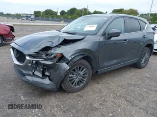2021 Mazda CX-5 Touring with VIN JM3KFACM1M0461510, listed as a IAAI auction lot 41660439 with 30,352 mi miles. Bid and sale history available at carsss.com. Image 17.