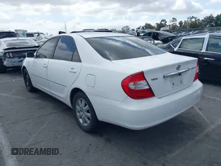 2003 Toyota Camry LE with VIN JTDBE32K530180834, listed as a IAAI auction lot 42255688 with 134,594 mi miles and . Bid and sale history available at DreamBid. Image 3.