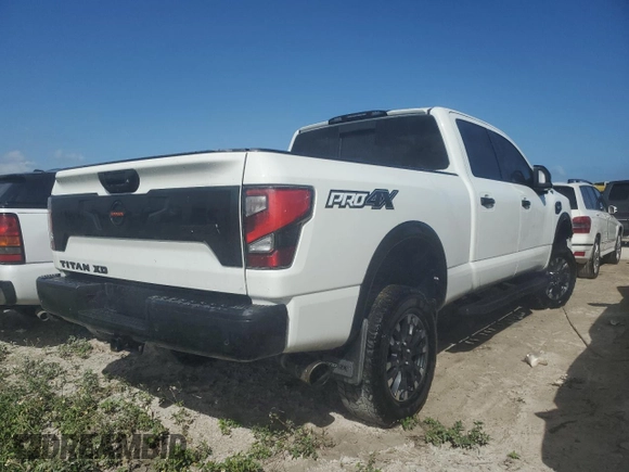 2021 Nissan Titan SV z VIN 1N6AA1FB2MN514566, wystawiony jako Copart lot #75194294 z przebiegiem 34 987 mil mil oraz Nie do naprawy • Non repairable. Historia ofert i sprzedaży dostępna na DreamBid. Obrazek 3.