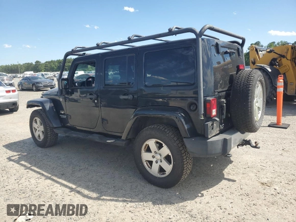 2012 Jeep Wrangler Unlimited Sahara with VIN 1C4HJWEG5CL205826, listed as a Copart auction lot 58222115 with 98,940 mi miles and Salvage title. Bid and sale history available at DreamBid. Image 2.