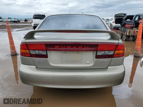 2000 Subaru Legacy with VIN 4S3BE6451Y7207874, listed as a Copart auction lot 59583325 with 57,861 mi miles and Salvage title. Bid and sale history available at DreamBid. Image 6.