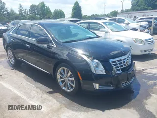 2013 Cadillac XTS Luxury z VIN 2G61P5S37D9101989, wystawiony jako IAAI lot #42242641 z przebiegiem 243 006 mil mil oraz . Historia ofert i sprzedaży dostępna na DreamBid. Obrazek 1.