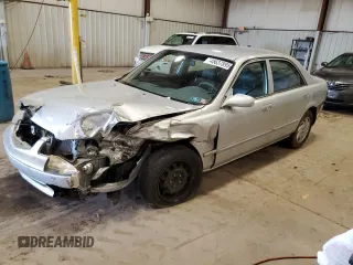 2000 Mazda 626 LX with VIN 1YVGF22C1Y5125842, listed as a Copart auction lot 45637895 with 84,487 mi miles and Salvage Title. Bid and sale history available at carsss.com. Image 1.