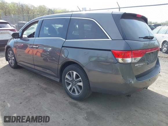 2014 Honda Odyssey Touring with VIN 5FNRL5H92EB073085, listed as a IAAI auction lot 42065913 with 120,834 mi miles and . Bid and sale history available at DreamBid. Image 3.