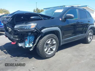 2019 Jeep Cherokee Trailhawk with VIN 1C4PJMBXXKD433284, listed as a IAAI auction lot 42020051 with 57,089 mi miles and . Bid and sale history available at DreamBid. Image 18.