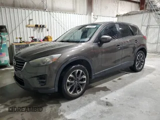 2016 Mazda CX-5 Grand Touring z VIN JM3KE2DY5G0821683, wystawiony jako Copart lot #51929905 z przebiegiem 119 392 mil mil oraz Czysty tytuł • Clean title. Historia ofert i sprzedaży dostępna na DreamBid. Obrazek 1.