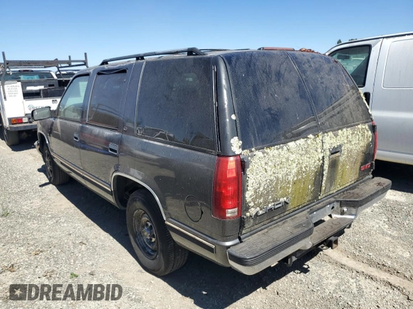 1999 GMC Yukon with VIN 1GKEC13R5XJ761595, listed as a Copart auction lot 69677904 with 174,735 mi miles and Clean Title. Bid and sale history available at carsss.com. Image 2.
