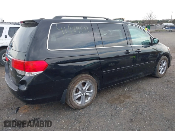 2010 Honda Odyssey Touring with VIN 5FNRL3H95AB040354, listed as a IAAI auction lot 41889501 with 155,069 mi miles. Bid and sale history available at carsss.com. Image 4.