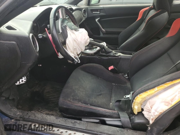 2014 Scion FR-S with VIN JF1ZNAA14E8700043, listed as a Copart auction lot 49283575 with 107,319 mi miles and Salvage Title. Bid and sale history available at DreamBid. Image 7.