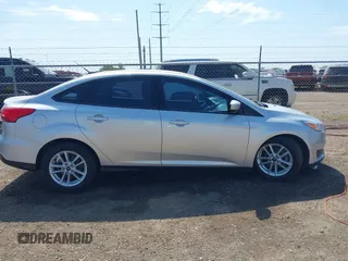 2018 Ford Focus SE z VIN 1FADP3FE0JL321530, wystawiony jako IAAI lot #42275532 z przebiegiem 65 412 mil mil oraz . Historia ofert i sprzedaży dostępna na DreamBid. Obrazek 13.