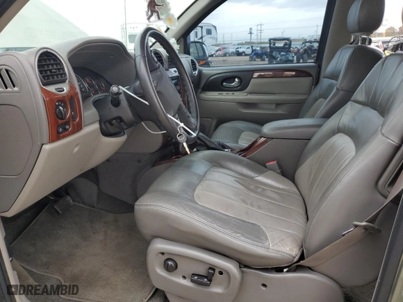 2004 GMC Envoy SLE with VIN 1GKDT13S242371123, listed as a Copart auction lot 50676215 with 156,980 mi miles and Salvage Title. Bid and sale history available at carsss.com. Image 7.