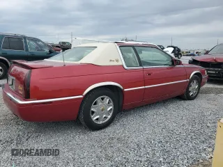 2001 Cadillac Eldorado ESC z VIN 1G6EL12Y11B103541, wystawiony jako Copart lot #45219055 z przebiegiem 46 179 mil mil oraz Tytuł czysty. Historia ofert i sprzedaży dostępna na DreamBid. Obrazek 3.