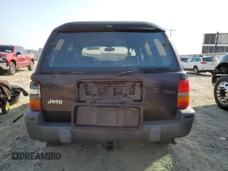 1993 Jeep Grand Cherokee Laredo with VIN 1J4GZ58S8PC656490, listed as a Copart auction lot 49377485 with 236,215 mi miles and Salvage Title. Bid and sale history available at carsss.com. Image 6.