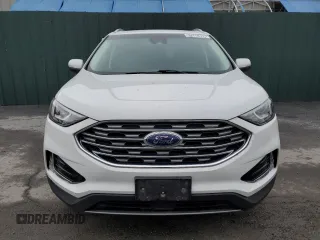 2020 Ford Edge SEL z VIN 2FMPK3J90LBB01559, wystawiony jako Copart lot #61365305 z przebiegiem 120 050 mil mil oraz Czysty tytuł • Clean title. Historia ofert i sprzedaży dostępna na DreamBid. Obrazek 5.