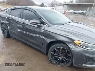 2019 Ford Fusion SEL with VIN 3FA6P0CD6KR141832, listed as a IAAI auction lot 41800102 with 142,282 mi miles and . Bid and sale history available at DreamBid. Image 6.