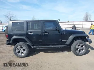 2009 Jeep Wrangler Unlimited X with VIN 1J4GA391X9L701403, listed as a IAAI auction lot 41890659 with 143,619 mi miles. Bid and sale history available at carsss.com. Image 13.