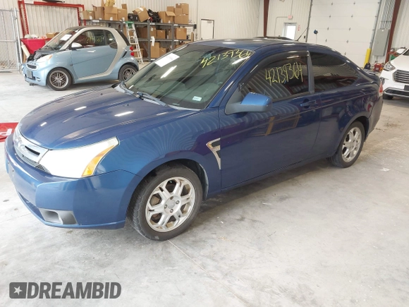 2008 Ford Focus SE with VIN 1FAHP33NX8W133127, listed as a IAAI auction lot 42139364 with 193,882 mi miles. Bid and sale history available at carsss.com. Image 2.