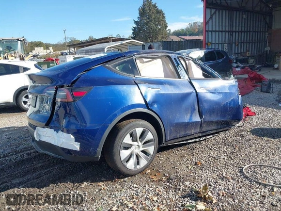 2024 Tesla Model Y Long Range with VIN 7SAYGDEEXRA265159, listed as a IAAI auction lot 40907008 with Not Provided miles and . Bid and sale history available at DreamBid. Image 4.