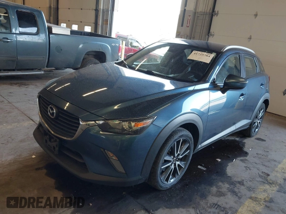 2018 Mazda CX-3 Touring z VIN JM1DKFC78J1323439, wystawiony jako IAAI lot #41725784 z przebiegiem 134 055 mil mil oraz . Historia ofert i sprzedaży dostępna na DreamBid. Obrazek 2.