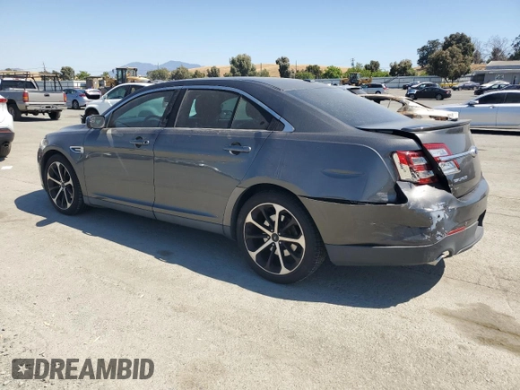 2015 Ford Taurus SEL with VIN 1FAHP2E8XFG209390, listed as a Copart auction lot 58992305 with 99,498 mi miles and Salvage title. Bid and sale history available at DreamBid. Image 2.