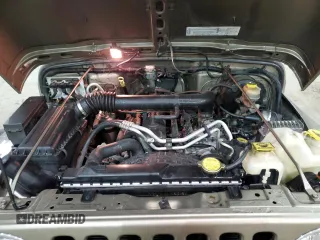 2003 Jeep Wrangler Rubicon z VIN 1J4FA69S13P345591, wystawiony jako Copart lot #41741685 z przebiegiem 85 335 mil mil oraz Szkoda całkowita • Salvage title. Historia ofert i sprzedaży dostępna na DreamBid. Obrazek 13.