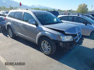 2015 Dodge Journey SXT with VIN 3C4PDDBGXFT660580, listed as a IAAI auction lot 42131133 with 151,357 mi miles and . Bid and sale history available at DreamBid. Image 1.