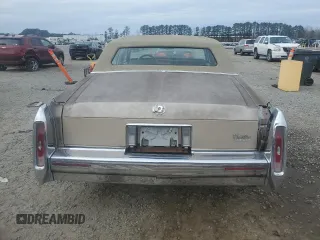1990 Cadillac Brougham z VIN 1G6DW54Y1LR710024, wystawiony jako Copart lot #88406975 z przebiegiem 183 170 mil mil oraz Tytuł czysty. Historia ofert i sprzedaży dostępna na DreamBid. Obrazek 6.