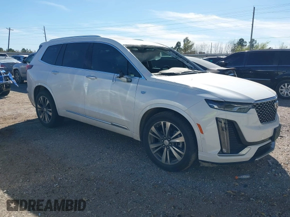 2021 Cadillac XT6 Premium Luxury z VIN 1GYKPCRS6MZ230499, wystawiony jako IAAI lot #41808404 z przebiegiem 86 933 mil mil oraz . Historia ofert i sprzedaży dostępna na DreamBid. Obrazek 1.